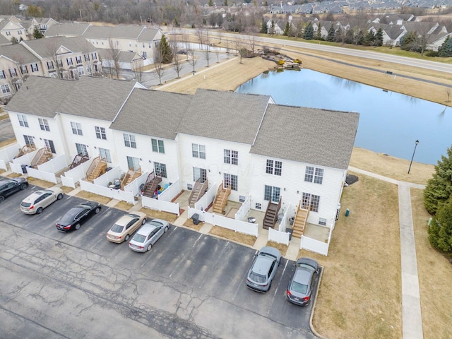 aerial view with a water view and a residential view