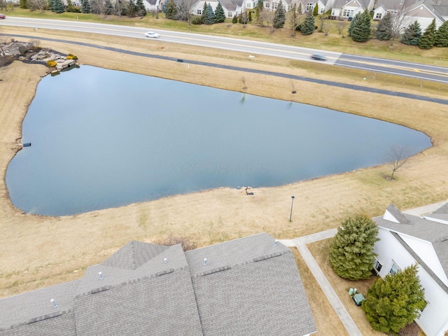 bird's eye view featuring a water view and a residential view