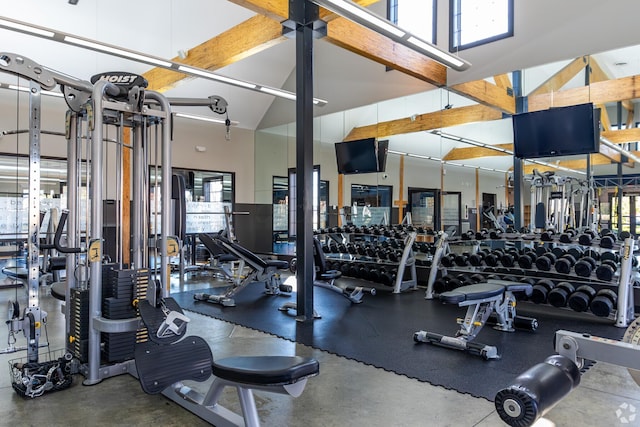 gym featuring high vaulted ceiling