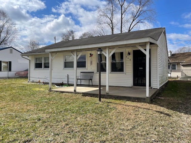 back of house featuring a yard and a patio