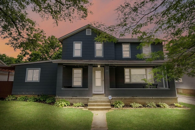 traditional-style house with a front lawn