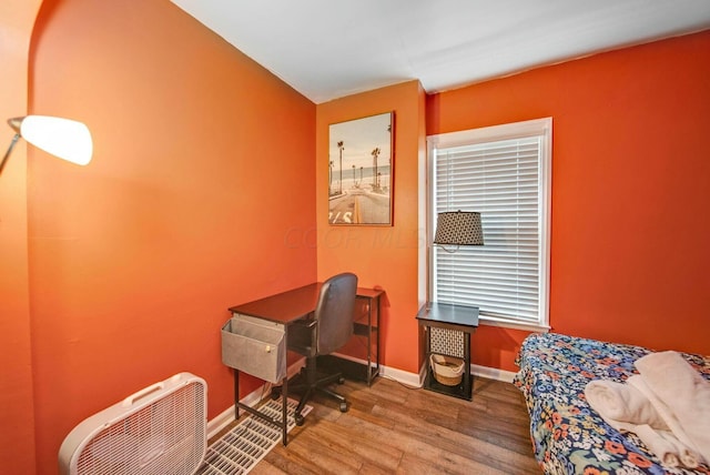 office area with wood finished floors and baseboards