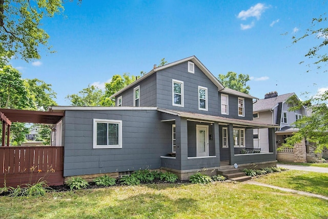 view of front of home with a front lawn and a porch