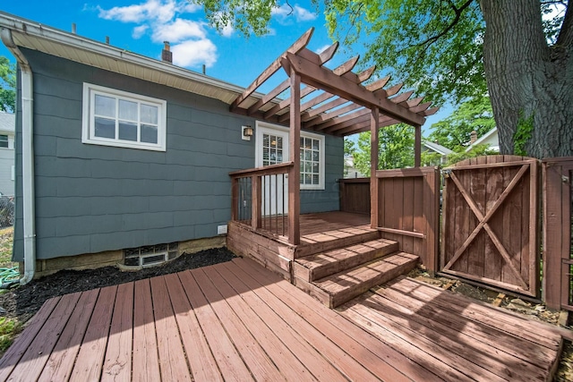 wooden terrace featuring fence, a gate, and a pergola