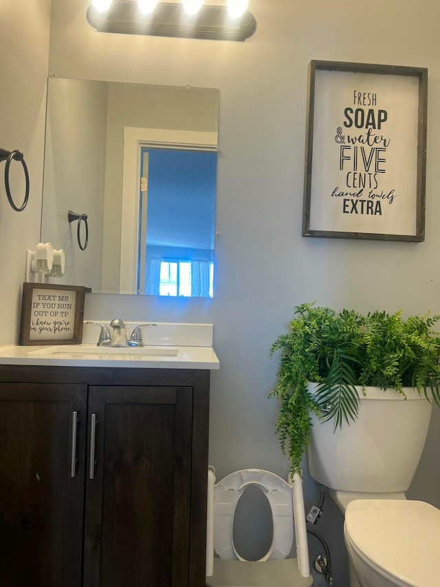 half bath with vanity and toilet