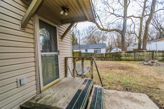 view of yard featuring a deck and a fenced backyard