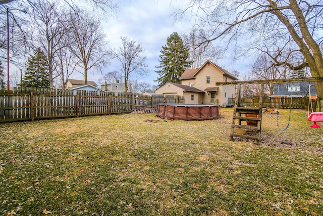 view of yard featuring a fenced backyard and a fenced in pool