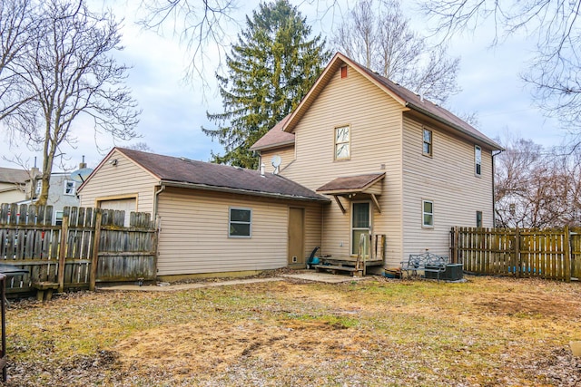 back of property with fence