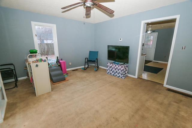 rec room featuring ceiling fan, carpet, and baseboards