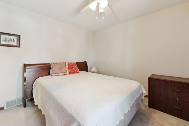 bedroom featuring carpet, visible vents, ceiling fan, and baseboards