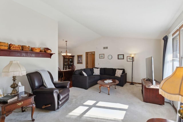 living area with lofted ceiling, an inviting chandelier, visible vents, and light colored carpet