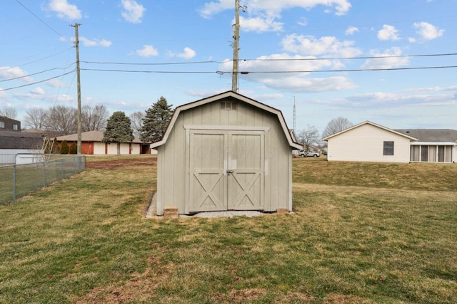 view of shed featuring fence