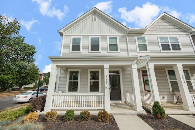 view of property featuring a porch and board and batten siding