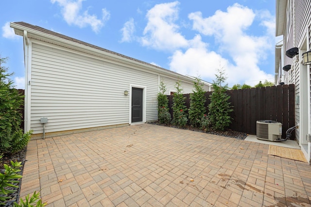 view of patio / terrace featuring fence and central air condition unit