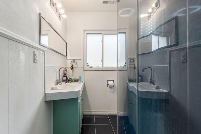 full bathroom with visible vents, vanity, and tile patterned floors