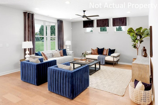 living room with a ceiling fan, recessed lighting, baseboards, and light wood-type flooring