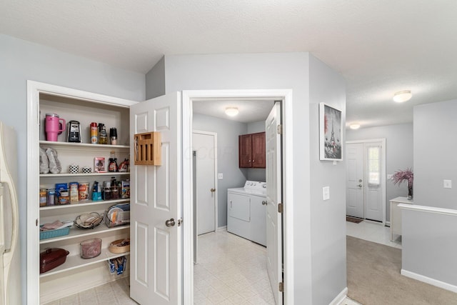 storage area with separate washer and dryer