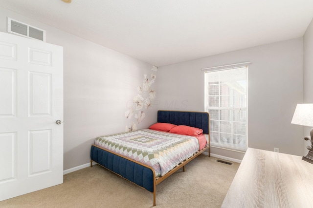 bedroom with baseboards, visible vents, and carpet flooring