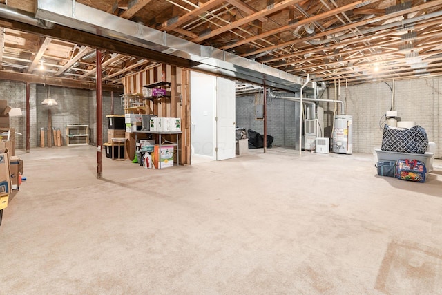 unfinished basement with gas water heater and brick wall