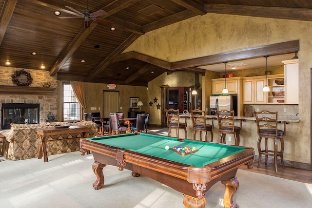 rec room with beamed ceiling, wooden ceiling, and a fireplace