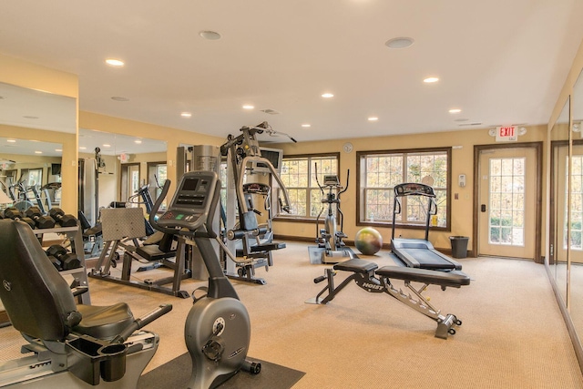 workout area featuring recessed lighting and baseboards