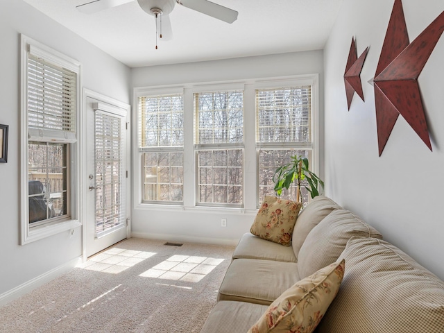 sunroom with visible vents and ceiling fan