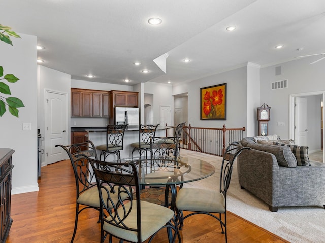 dining space with recessed lighting, visible vents, baseboards, and wood finished floors