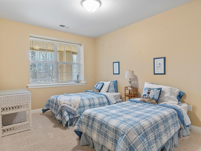 bedroom featuring carpet, visible vents, and baseboards