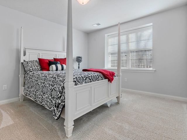 bedroom with visible vents, baseboards, and carpet flooring