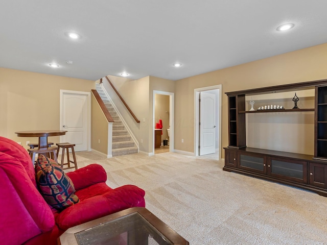 carpeted living room featuring recessed lighting, stairway, and baseboards