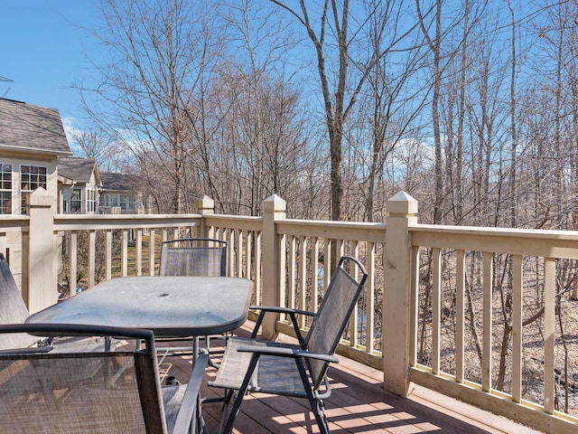 wooden terrace with outdoor dining area