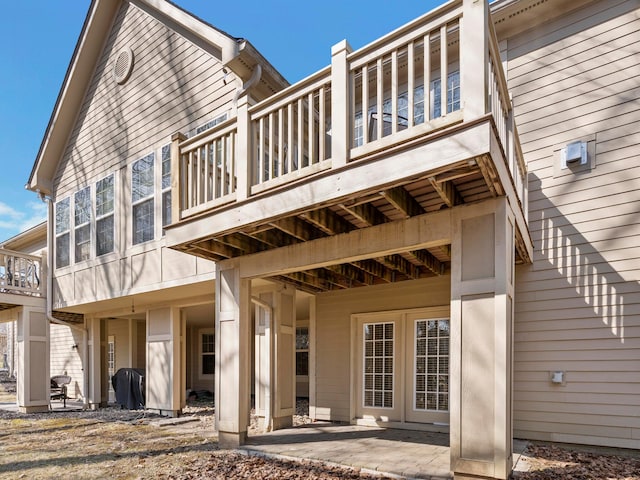 rear view of property featuring a patio area