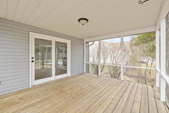 unfurnished sunroom with wood ceiling