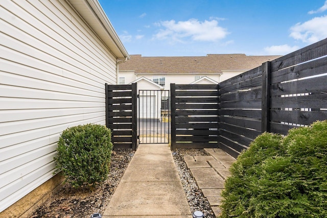 view of gate featuring fence