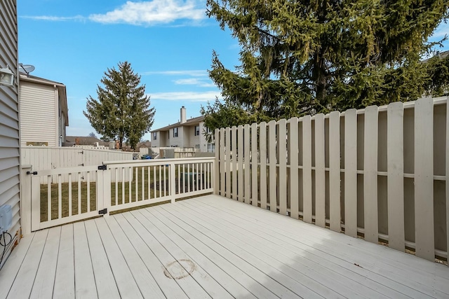 wooden terrace featuring fence and a residential view