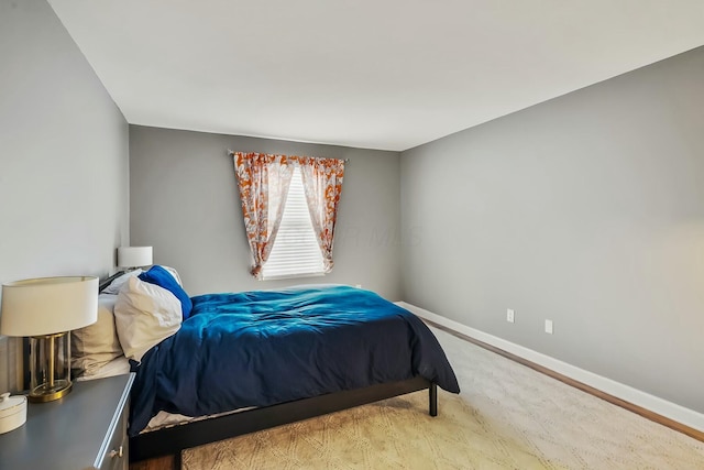 bedroom featuring baseboards