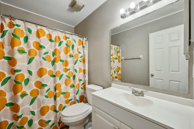 bathroom featuring toilet, curtained shower, vanity, and visible vents