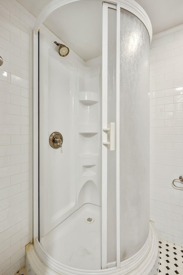 bathroom with a shower stall