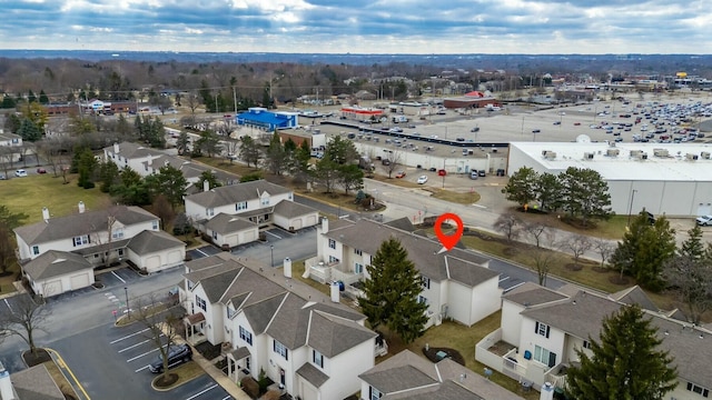 birds eye view of property with a residential view