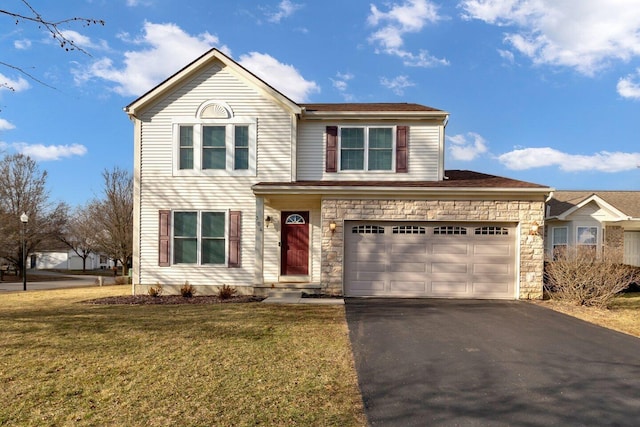 traditional-style house featuring stone siding, aphalt driveway, and a front lawn