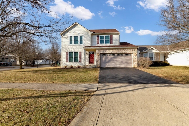 traditional-style home featuring a garage, driveway, a front lawn, and stone siding