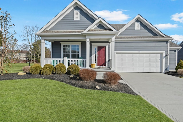 view of front of house with concrete driveway, roof with shingles, an attached garage, a porch, and a front yard