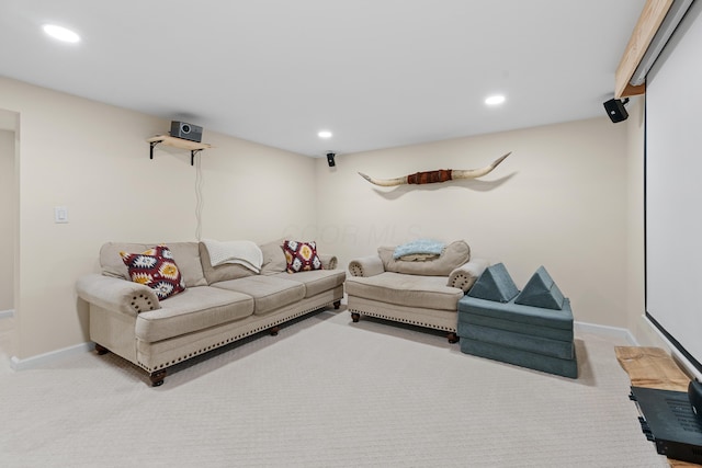 carpeted living room featuring baseboards and recessed lighting