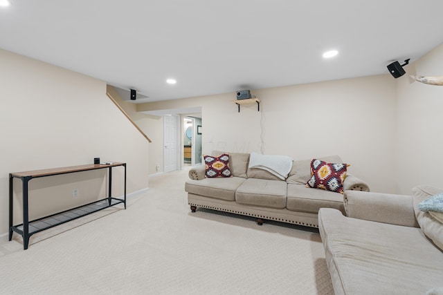 living room featuring baseboards, carpet flooring, and recessed lighting