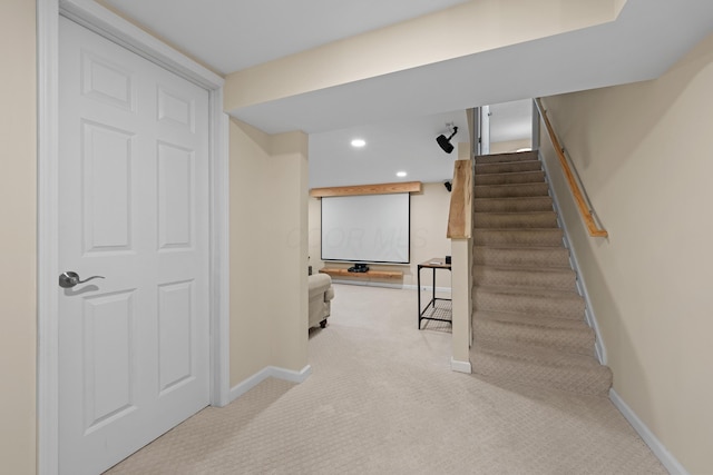 stairway with baseboards, carpet flooring, and recessed lighting