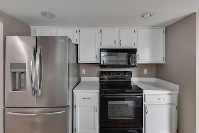 kitchen featuring a textured ceiling, black appliances, light countertops, and white cabinets