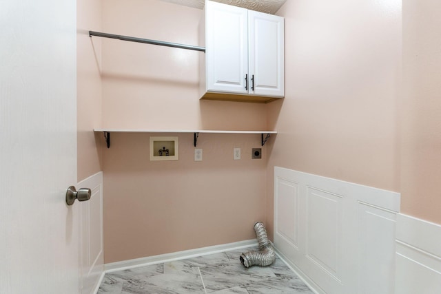 washroom featuring marble finish floor, cabinet space, baseboards, hookup for an electric dryer, and hookup for a washing machine