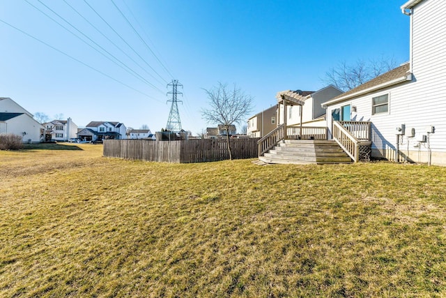 view of yard featuring fence, a pergola, a residential view, and a wooden deck