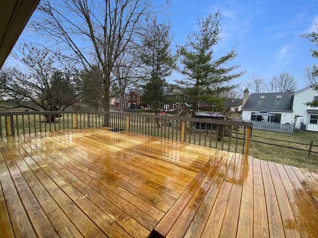 wooden deck featuring a yard