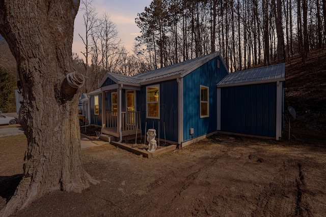 view of property exterior featuring metal roof